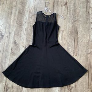 Black skater style dress with black sheer top